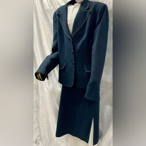 Navy Suit with white stitch detail on jacket.